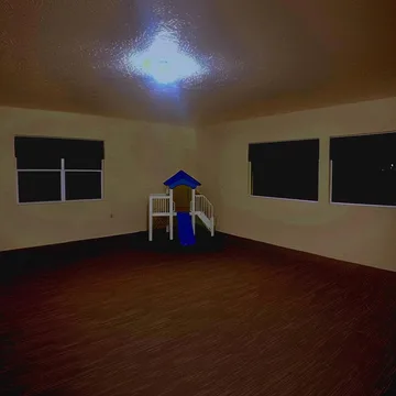 Empty wooden floor beneath a star of light.