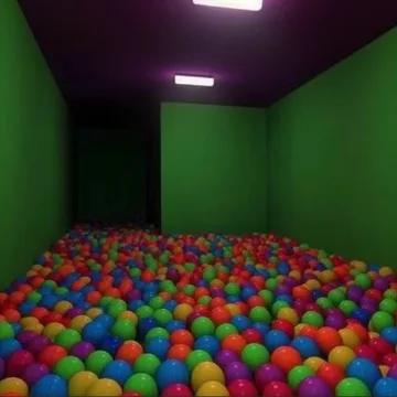 Ball pit in a green room with purple lighting.
