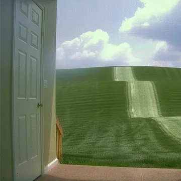 Open door to a sunlit green hill.