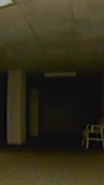 Single chair in a dark basement.