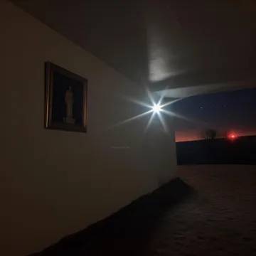 Light flaring at the corner of a dim corridor.