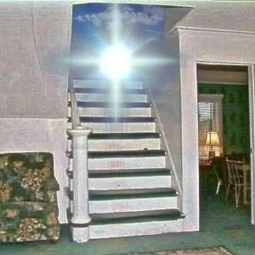Sunburst above an outdoor staircase.