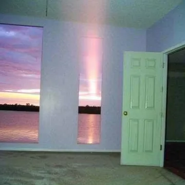 Pastel room with a glowing vertical shaft of light.