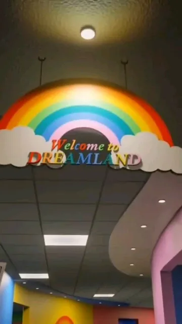 Rainbow mural in an empty playroom.