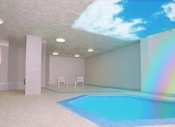 Rainbow in a pale indoor pool room.