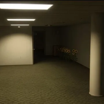 Bare basement with pillars under fluorescent lights.