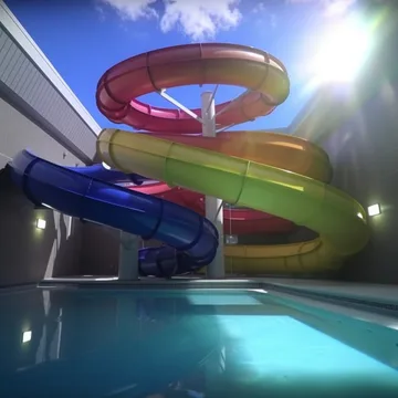 Spiral water slide beneath a bright sun.