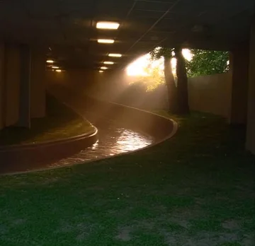 Light falling onto a curved indoor water channel.
