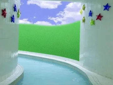 Curved pool in a room painted with clouds.