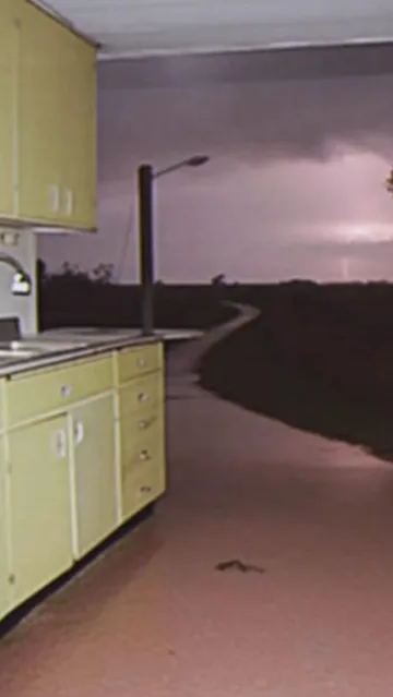 Open kitchen facing a dark road.