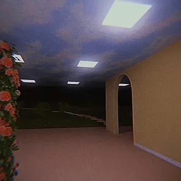 Empty pink corridor with flowers along one wall.