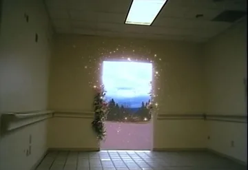 Doorway opening onto bright blue sky.