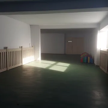 Sunlight crossing a wide empty landing.