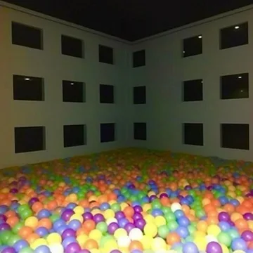 Ball pit filling an apartment courtyard.
