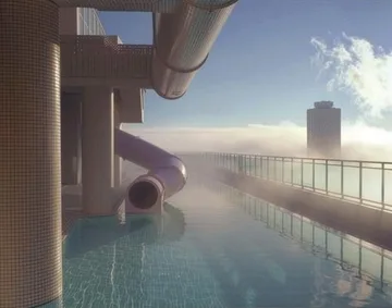 Water slides beside a window overlooking clouds.