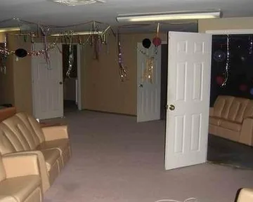 Open doors and chairs in an empty basement.
