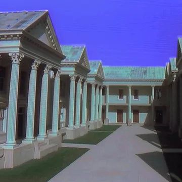 White colonnade under a bright blue sky.