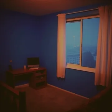 Small table in a blue room at dusk.