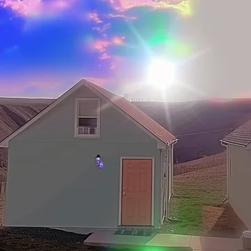 Rainbow light above a pale house.