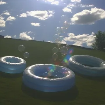 Circular pools beneath a blue sky.