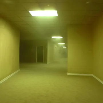 Empty corridor under yellow fluorescent lights.