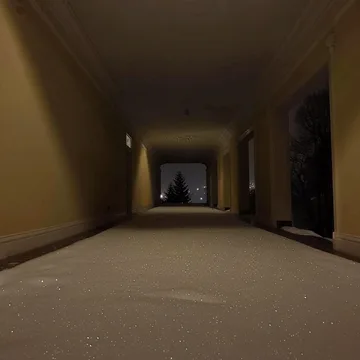 Dark staircase receding toward a small light.
