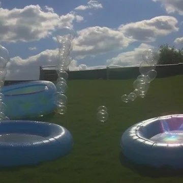 Circular pools with fountains under an open sky.