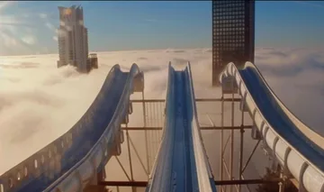 Long slides overlooking distant towers.