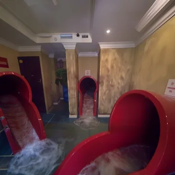Red slides flooding an ornate room.