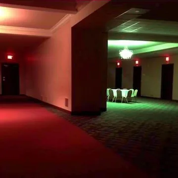Red and green light in an empty basement.