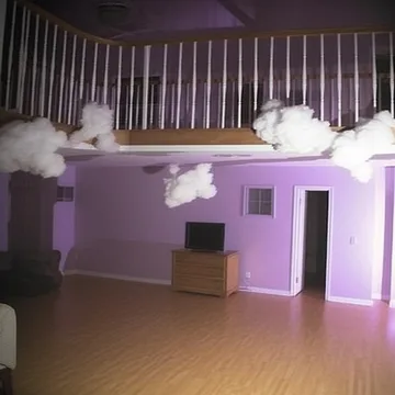 Clouds floating in a purple two-story room.