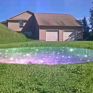 Glowing purple circle on a suburban lawn.