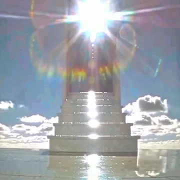 Stairway ascending above clouds into a bright sun.