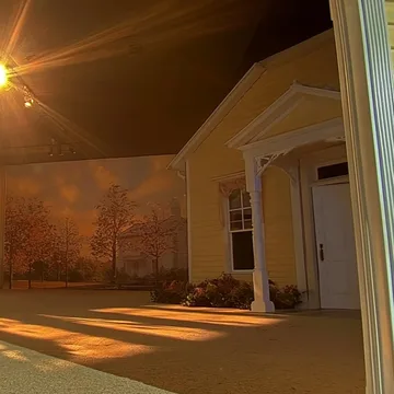 Golden light across an open doorway at night.