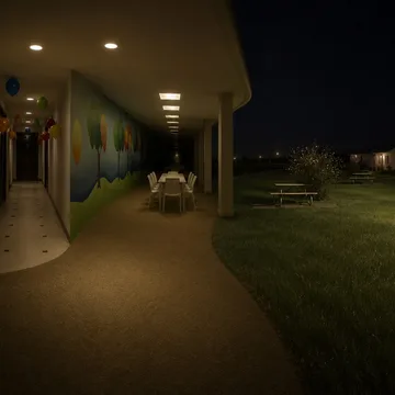 Covered outdoor corridor beside a night landscape.